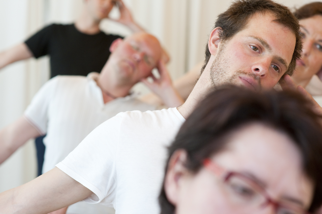 Menschen im Yoga Unterricht